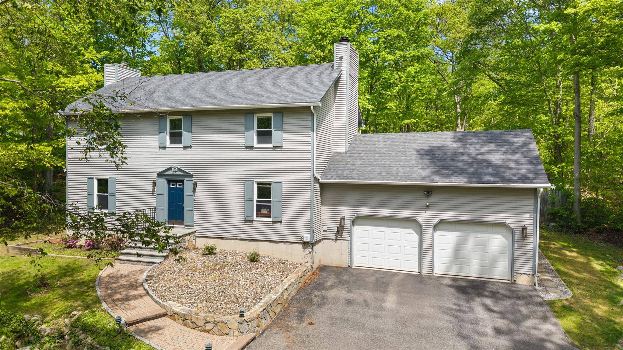 Charming colonial home on a beautifully landscaped and peaceful acre.