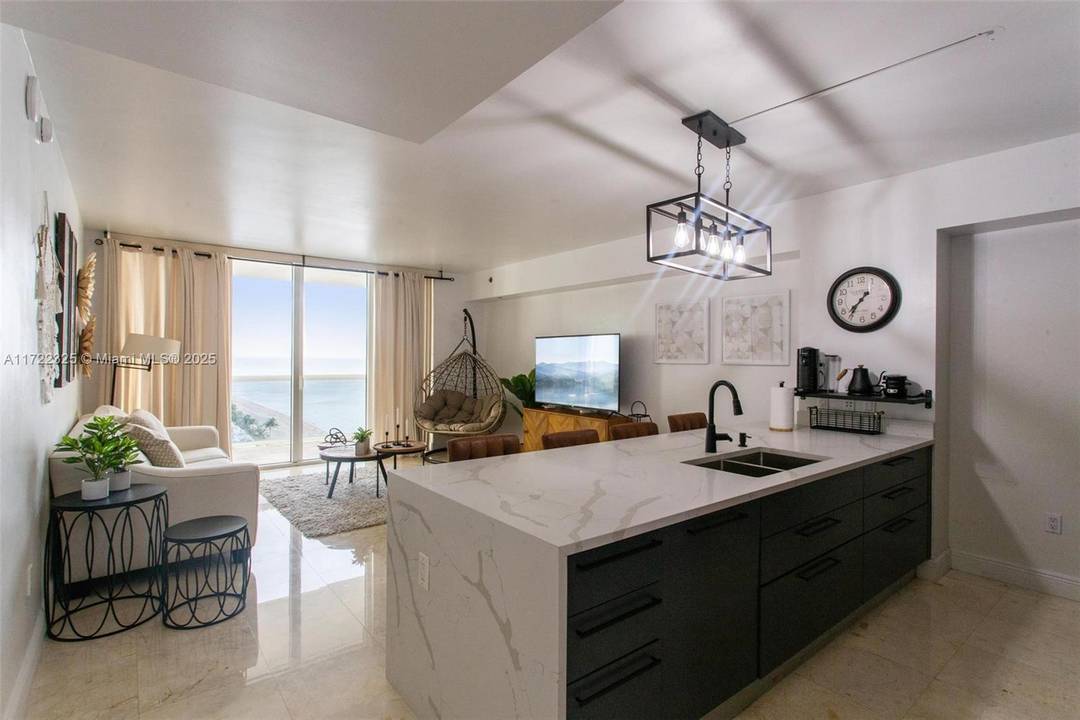 Experience the epitome of luxury in this exquisite studio plus den condo in desirable 12 line, featuring 1 bathroom, captivating NE exposure, and breathtaking ocean views.