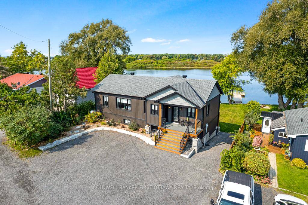On the St Lawrence River, new 2022 walkout bungalow offers spectacular views of the river.
