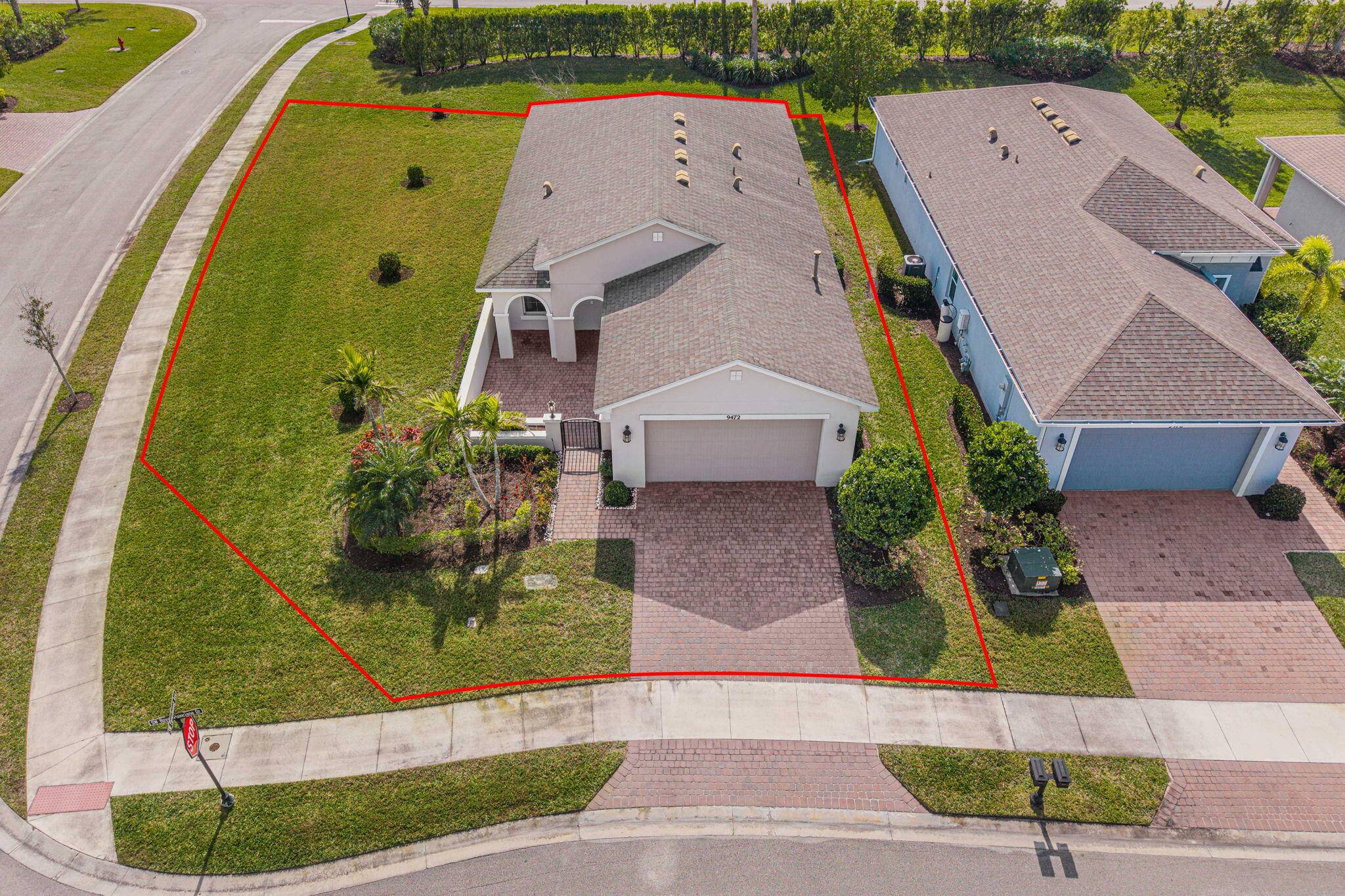Beautiful, oversized corner lot in the Vitalia gated community of Tradition.