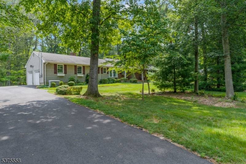 Nestled in the highly sought after Warren Township, this charming ranch style home offers comfort, privacy, and natural beauty on a serene, wooded lot for ultimate tranquility.