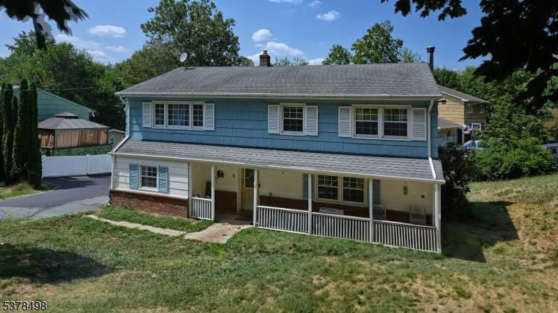 This corner lot tucked into a desirable Wanaque neighborhood is ready for you to put your personal touch on !