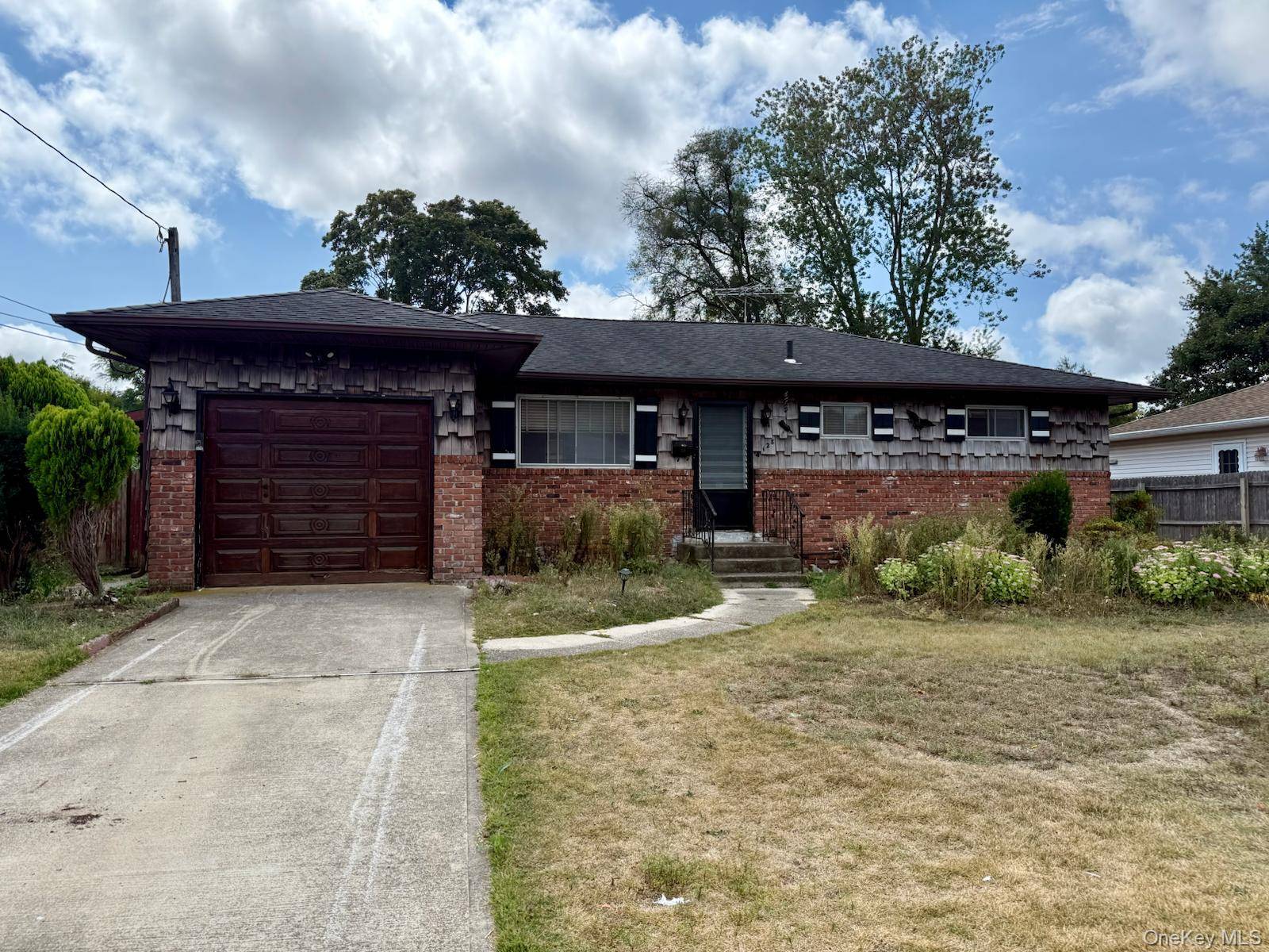 Charming Bay Shore home with endless potential !
