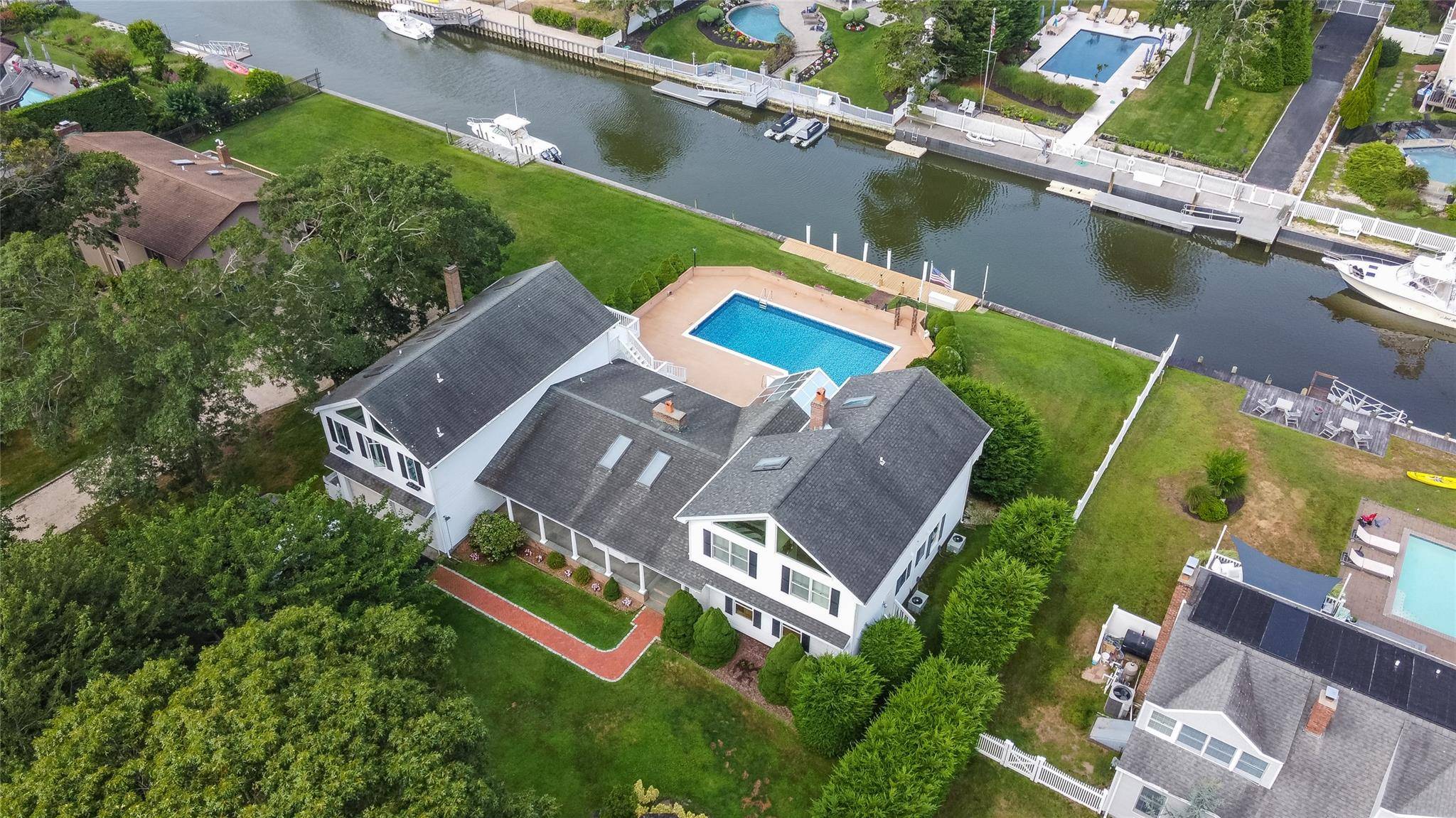 Located in Hampton Bays exclusive Old Harbor Colony community on a quiet street, 20 Oak Lane is a short drive to ocean beaches, waterfront dining, and Hampton Bays town, and ...