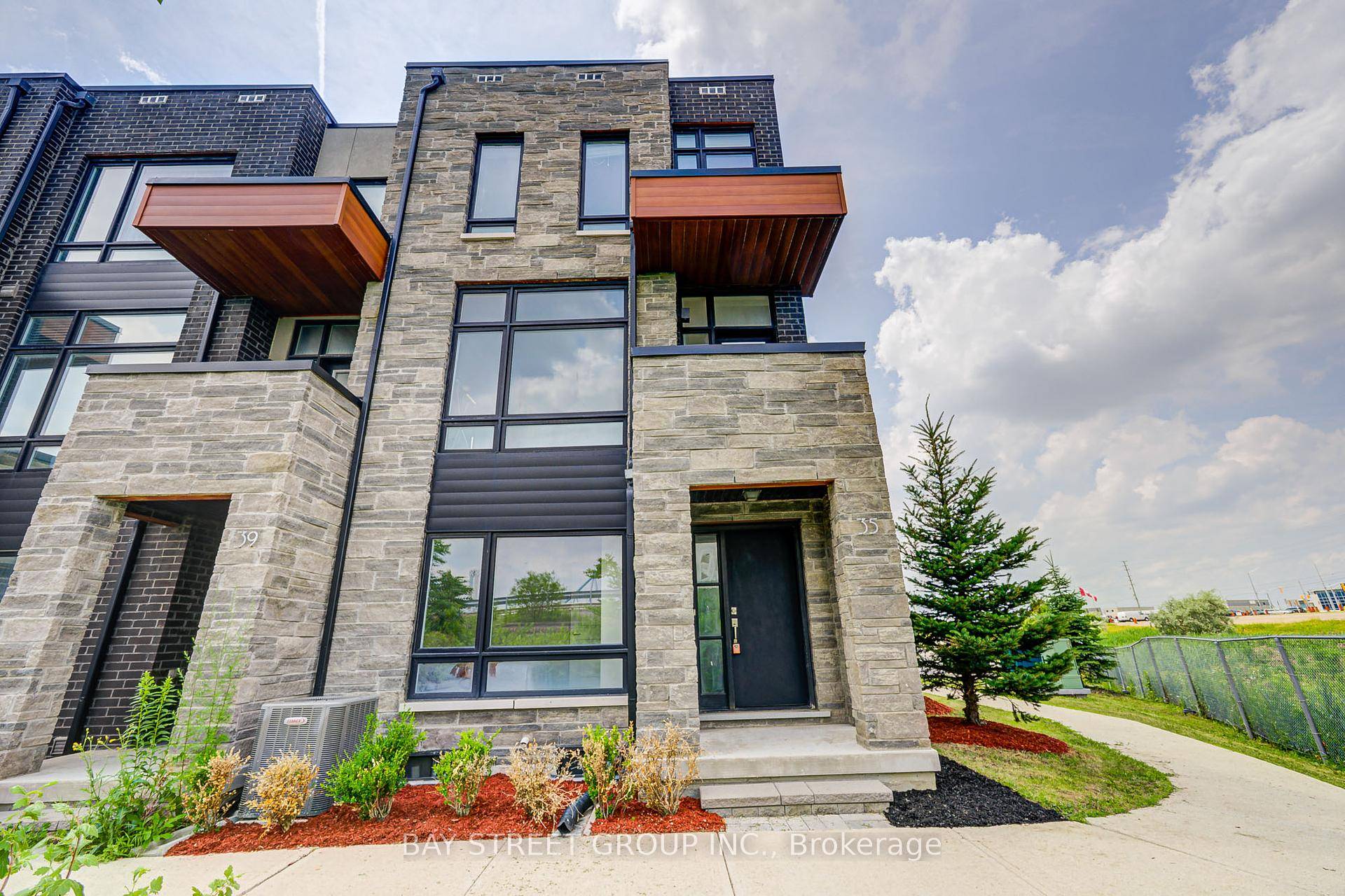 Exceptionally rare 4 bedroom, 4 washroom, 2 car garage end unit townhome situated on one of the largest lots in the Vellore Village complex.