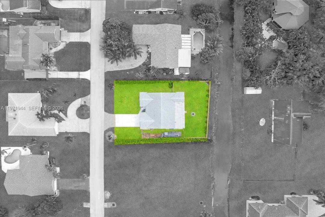 This incredible completely reimagined and updated single family residence located in the Plantation Acres area, sits on a 12, 443 square foot waterfront lot.