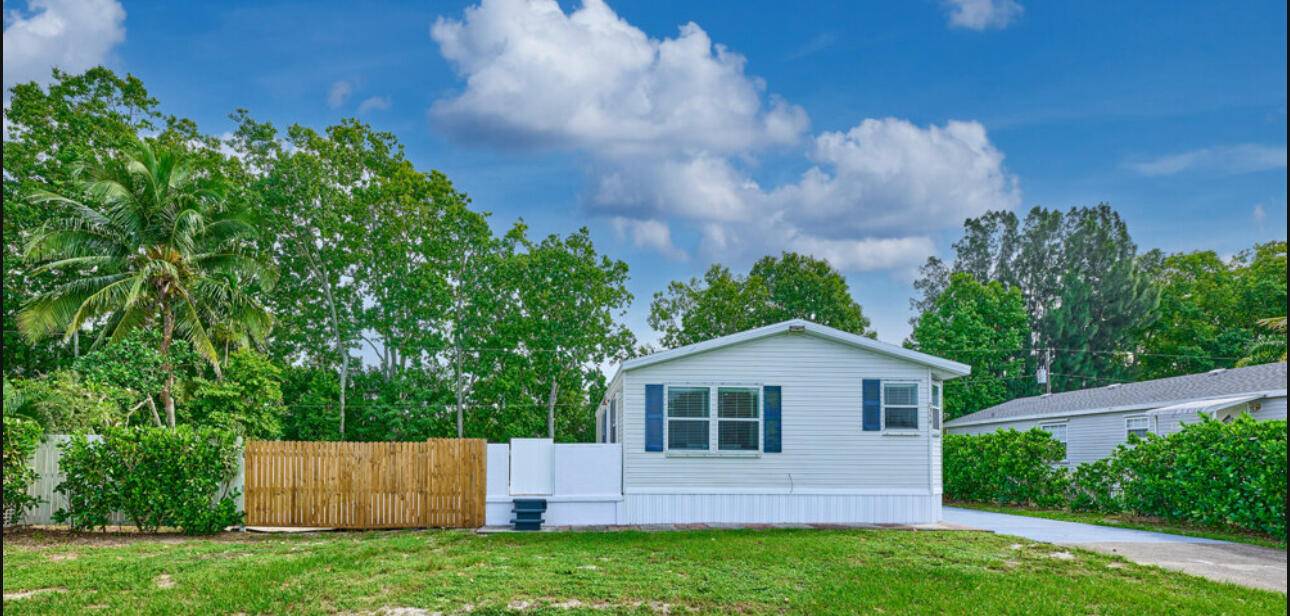 Fully renovated 2 bedroom, 2 bathroom manufactured home located at 7358 SE Eagle Ave, Hobe Sound, Florida.