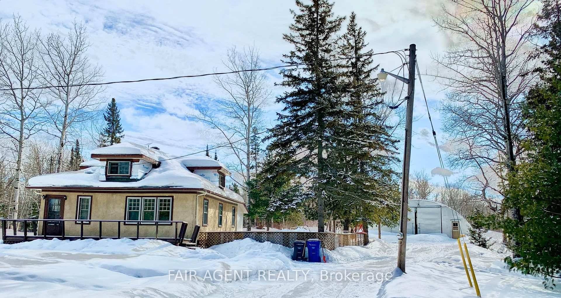 Set on 40 private acres just outside Temiskaming Shores, this charming 1.