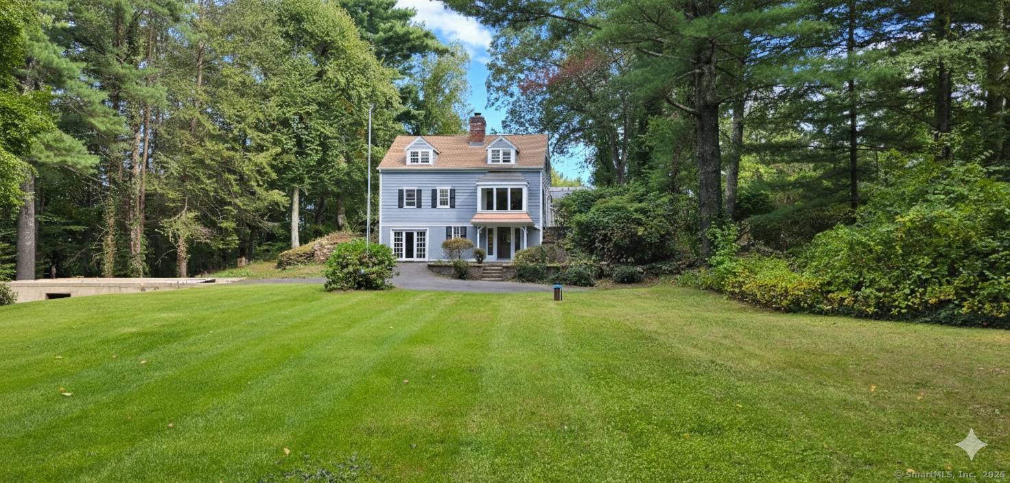 Welcome to 187 W Avon Road, Avon CT, a rare opportunity to own an original Cape Cod style home privately set on 4.