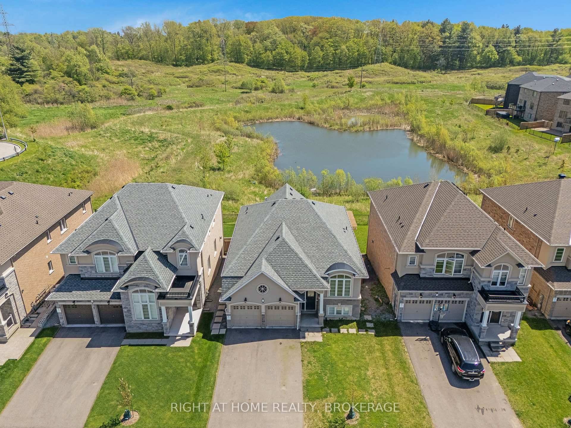 Raised Bungalow with Legal Walkout Basement Apartment Overlooking the Pond in Sought After Tiffany Hills.