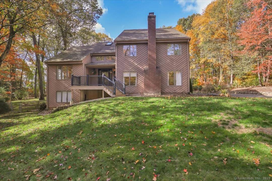 Experience ultimate privacy and tranquility in this beautifully landscaped home, set on a secluded rear lot with a wooded backdrop.