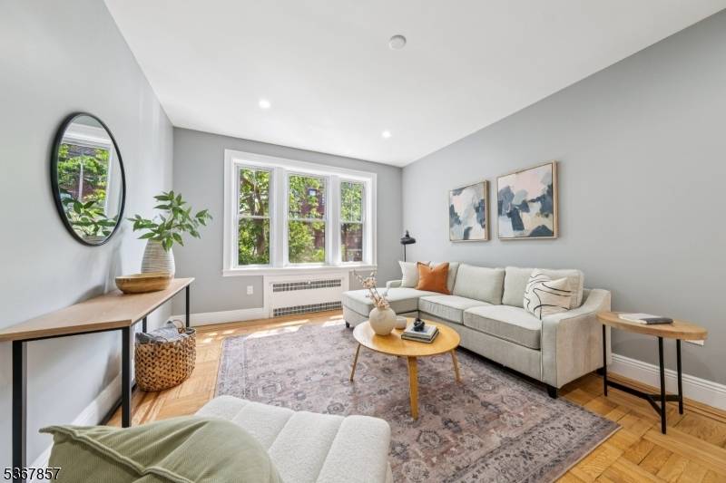 Move right into this fully renovated modern condo in the vibrant heart of Jersey City.