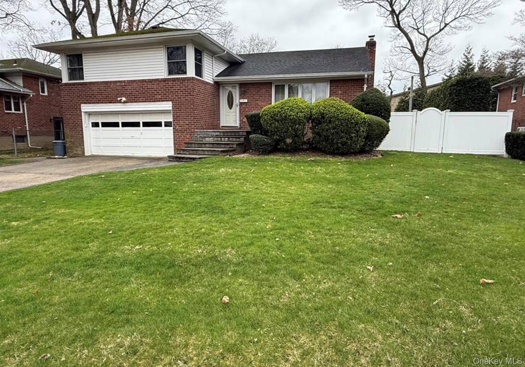 WELL MAINTAINED LARGE SPLIT LEVEL HOME IN EAST MEADOW DISTRICT OFFERS 3 BEDROOMS, 2.