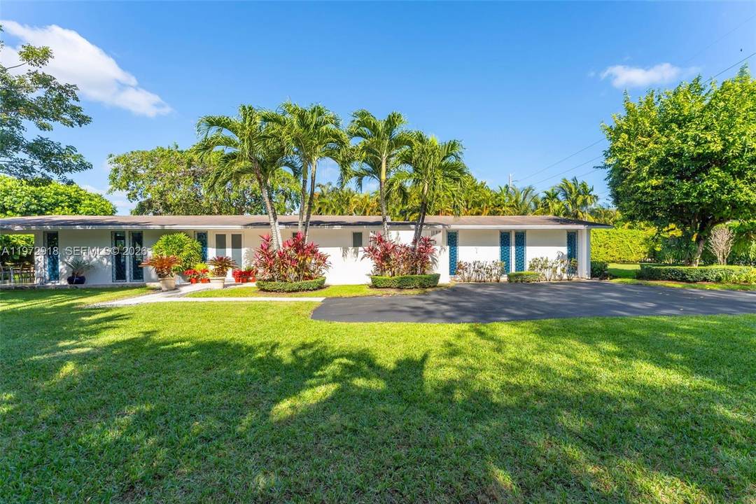 Discover a rare opportunity in Pinecrest with this beautifully redone one story residence plus a vacant lot next door, offering exceptional flexibility, privacy, and long term value.