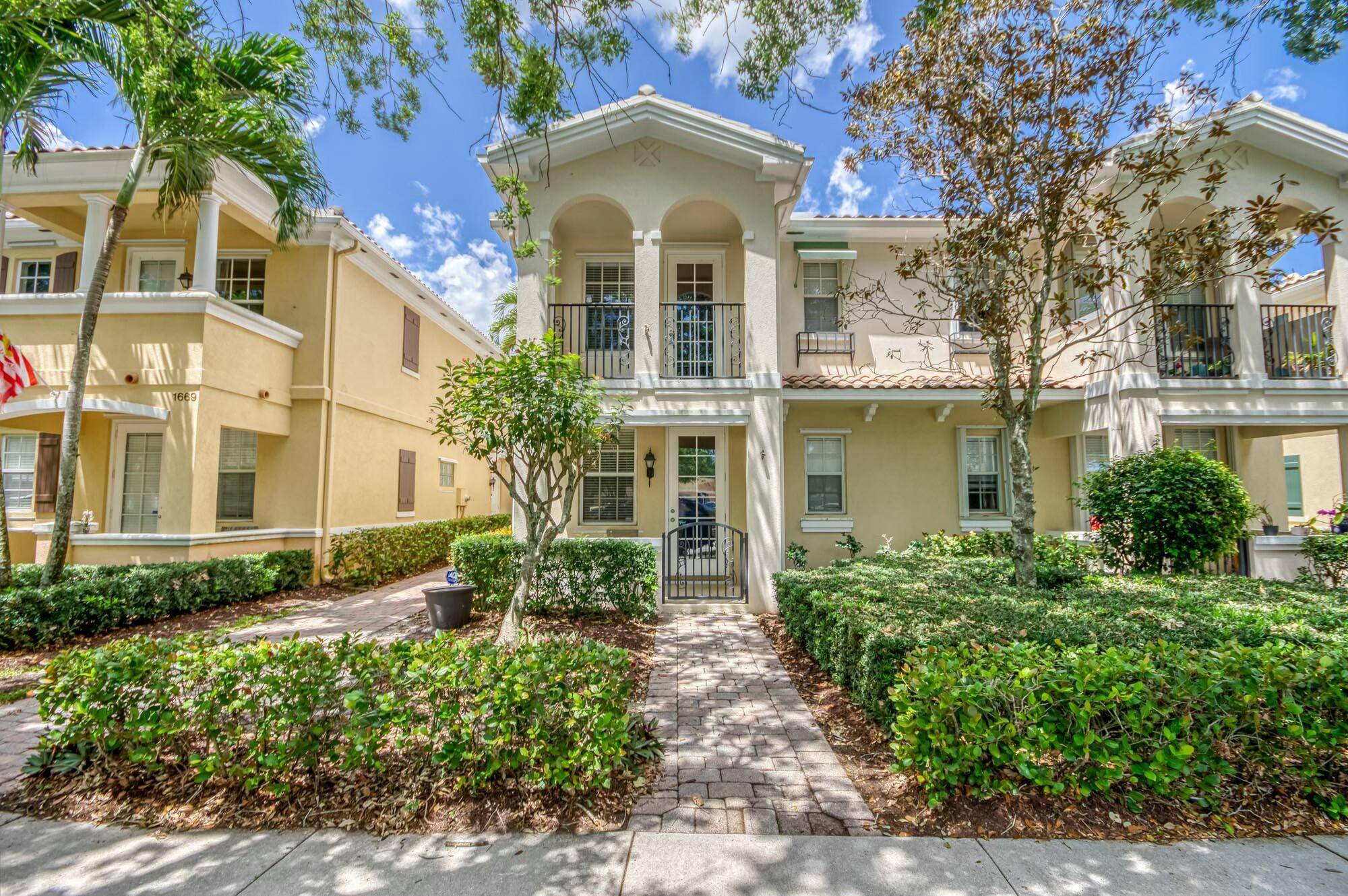 Enjoy the best of Florida living in this gorgeous two story townhome in Tuscany, a sought after tree lined community in Abacoa bordering a wildlife preserve.