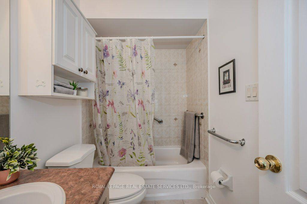 Rarely Offered End Unit Freehold Bungalow Townhome in Sought After West Oak Trails !