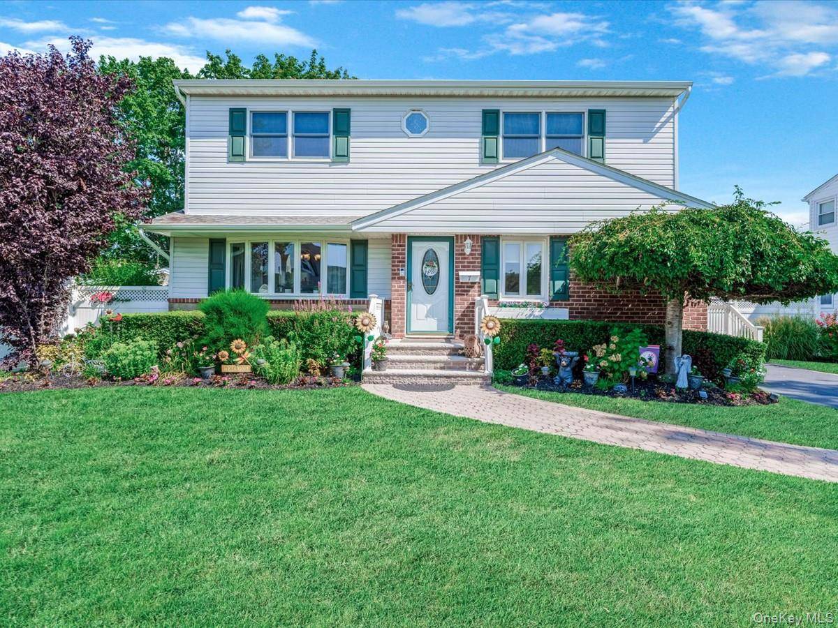 Welcome to this meticulously maintained Colonial nestled in the heart of Hicksville, blending classic charm with space and comfort.