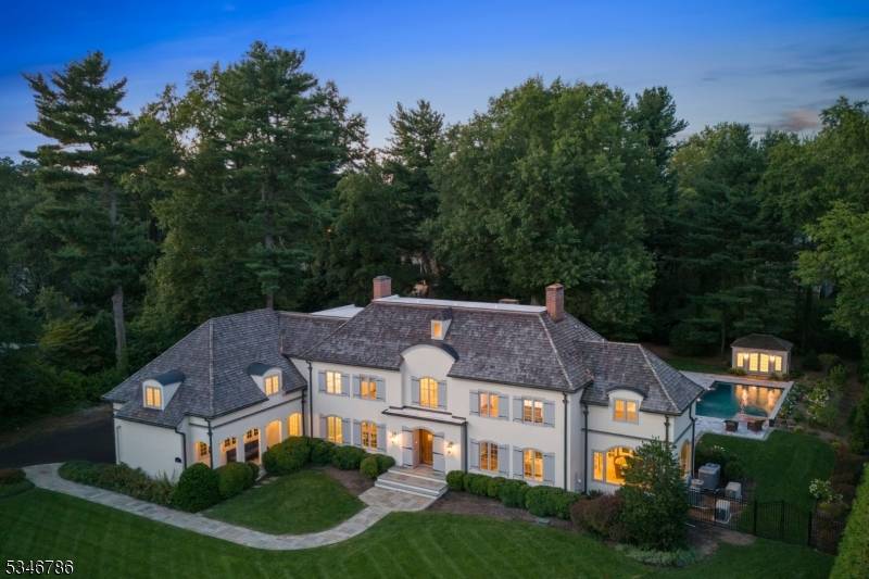 Incredible custom home, built on one level acre, situated on coveted Linden Lane, a private road in the Rolling Hills Section.
