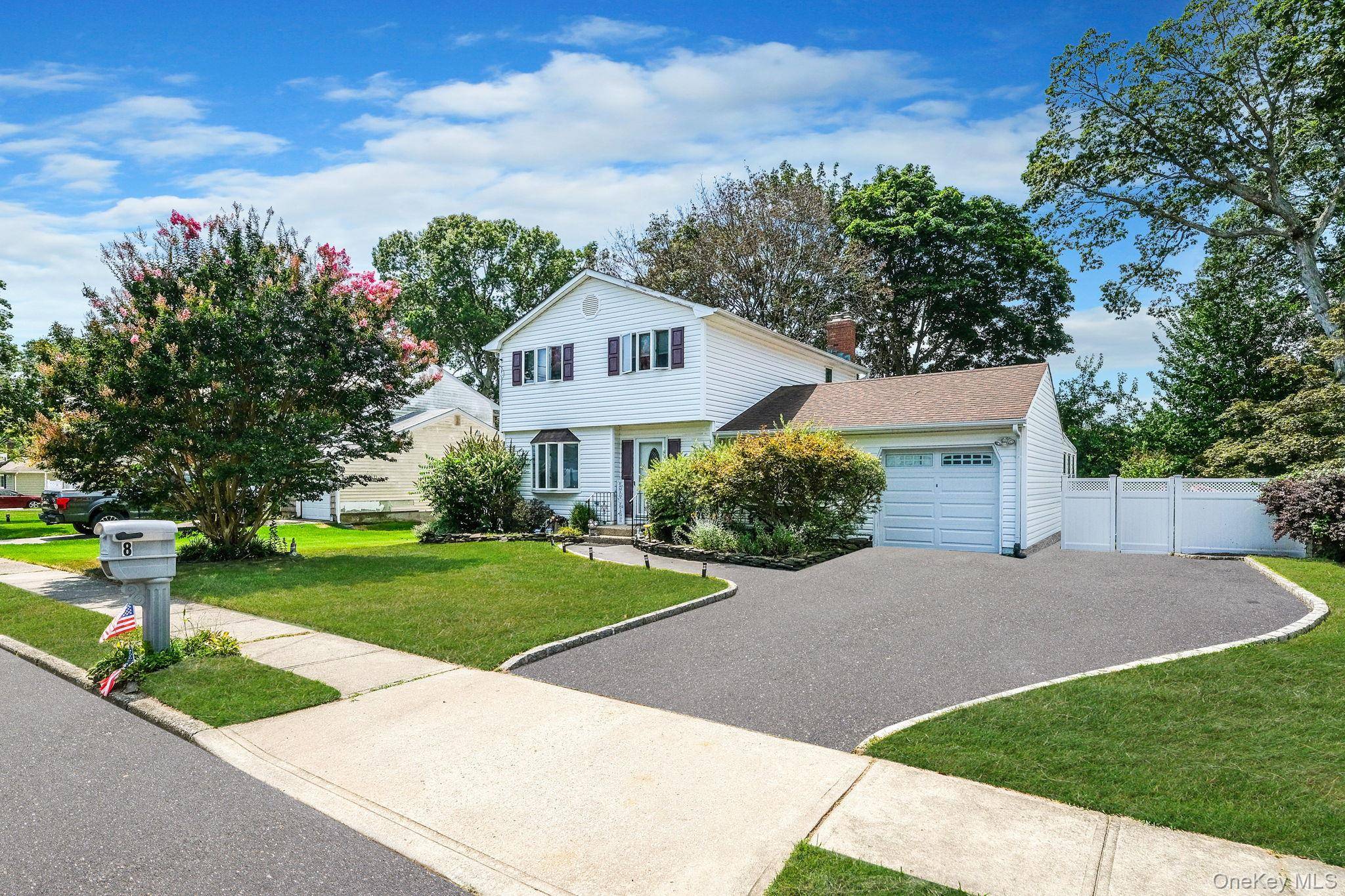 Welcome to this beautiful 4 bedroom, 2 bathroom home located in the heart of the Incorporated Village of Lake Grove in Middle Country School District.