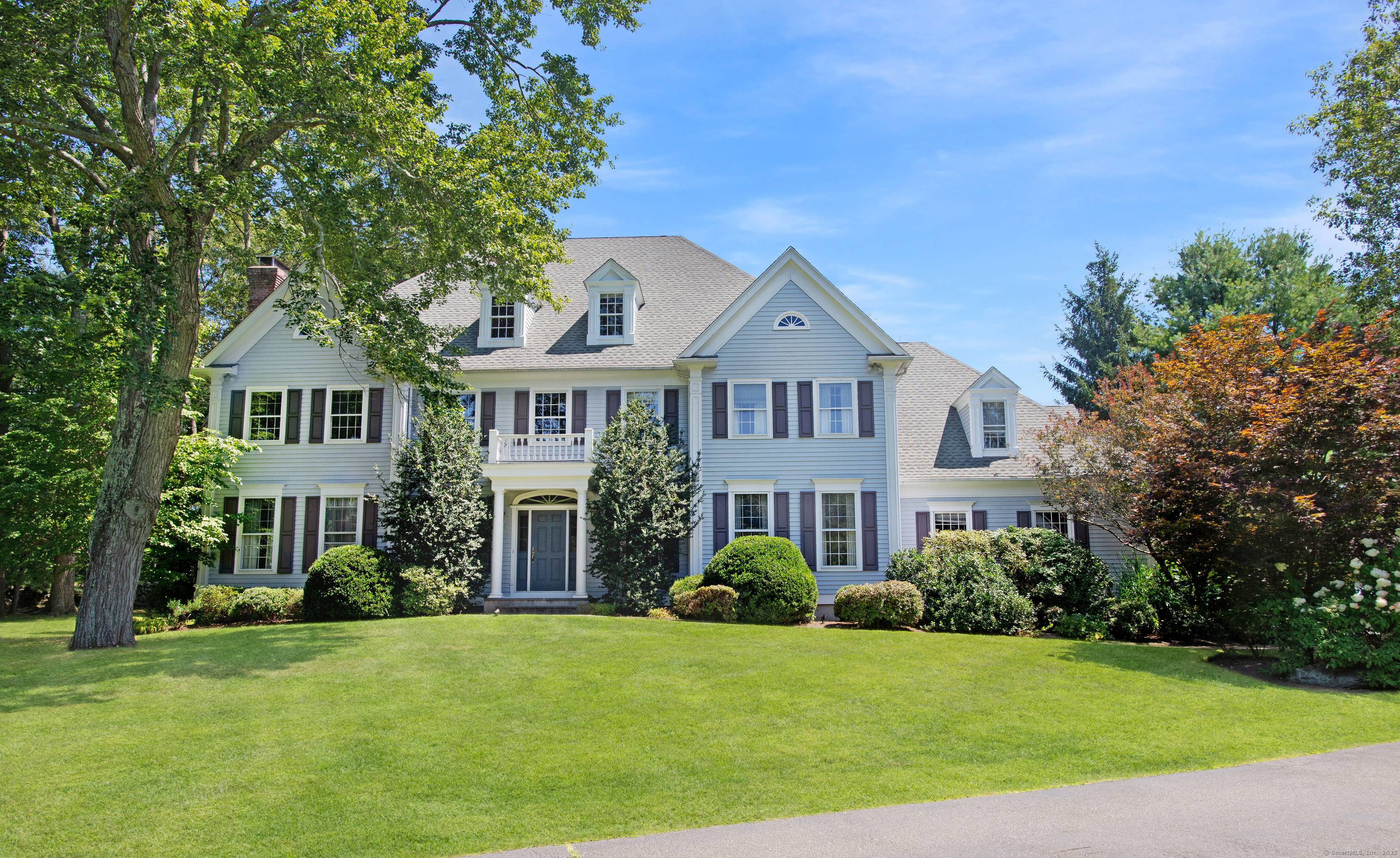 Welcome home to this classic Colonial on one of South Ridgefield's most beautiful and coveted roads.
