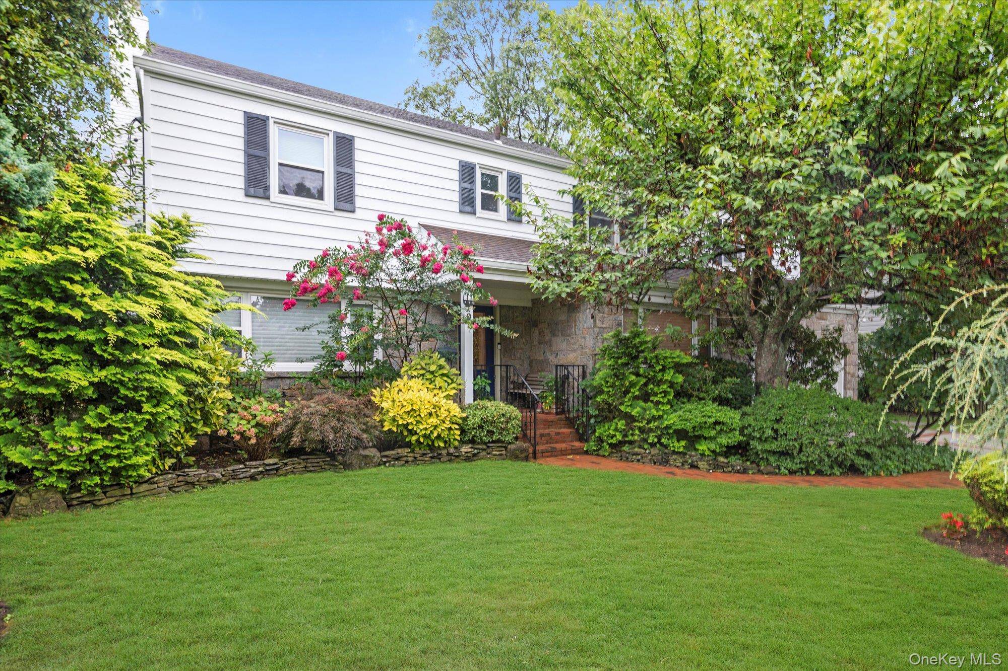 Situated perfectly in the middle of a 100 x 100 property, this traditional center hall Colonial offers privacy and location with all of the modern touches.