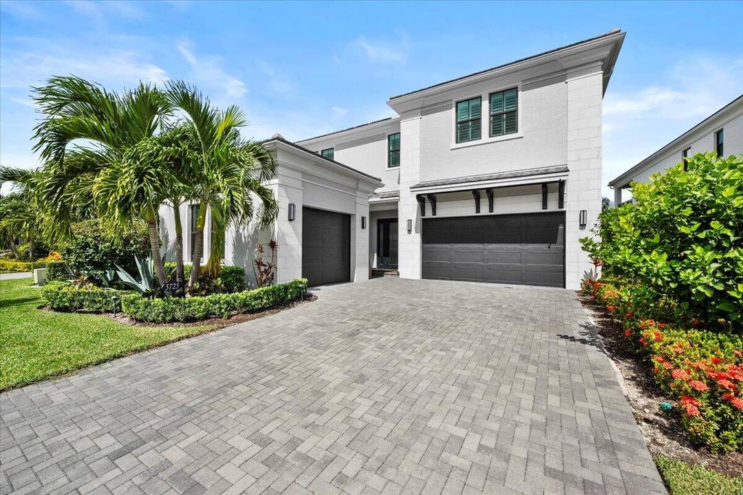 Highly upgraded Mondrian model with an oversized pool, impressive lake views and a custom outdoor kitchen and covered entertainment area with drop down screens.