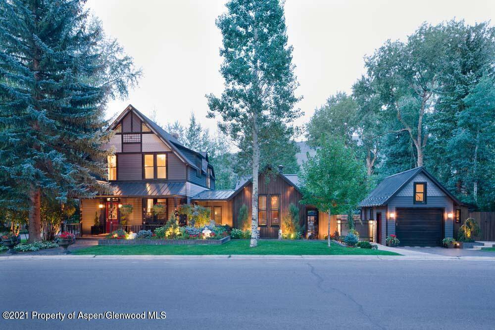Beautiful open living area boasts elegant custom furnishings, a gas fireplace and extensive entertaining area that opens to the kitchen and patio.
