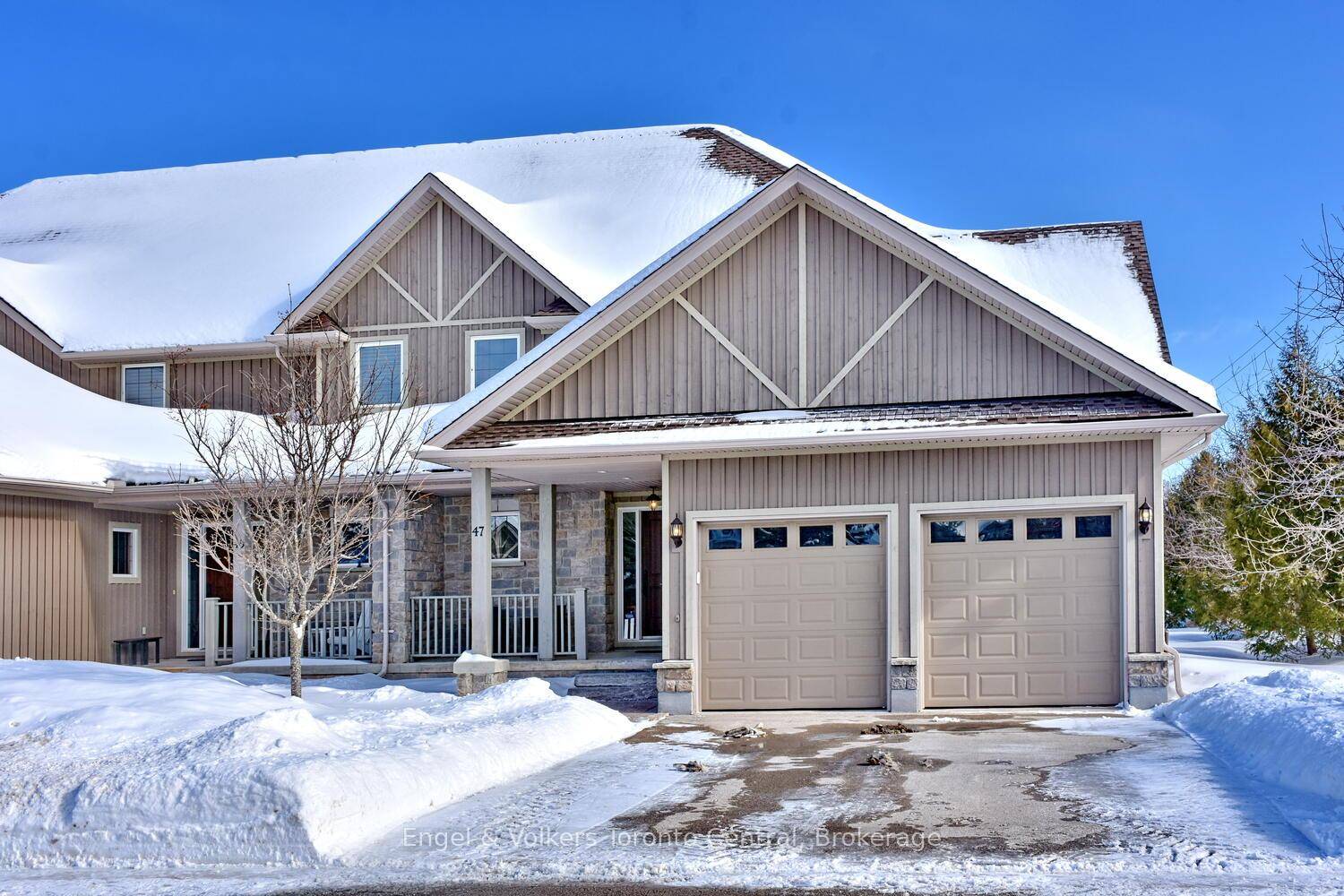 TURN KEY MOVE IN FOR SKI SEASON executive townhome is an end unit in the desirable Far Hills community.