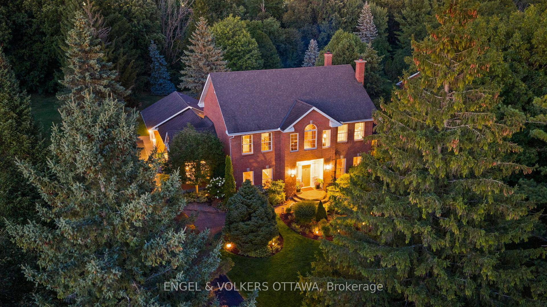 Poised on a serene ravine lot within the prestigious enclave of Manotick Estates, this beautiful Georgian inspired all brick residence embodies distinguished architectural character and timeless elegance.