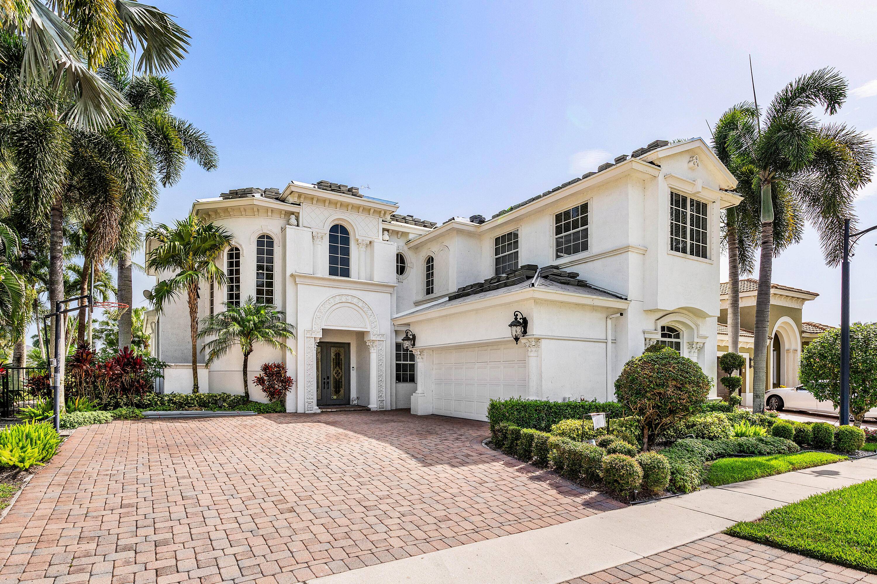 MIZNER COUNTRY CLUB GOLF EQUITY IS IMMEDIATELY AVAILABLE WITH THIS HOME THIS EXCEPTIONAL HOME HAS A NEW FLAT TILE ROOF WITH NEW GUTTERS.