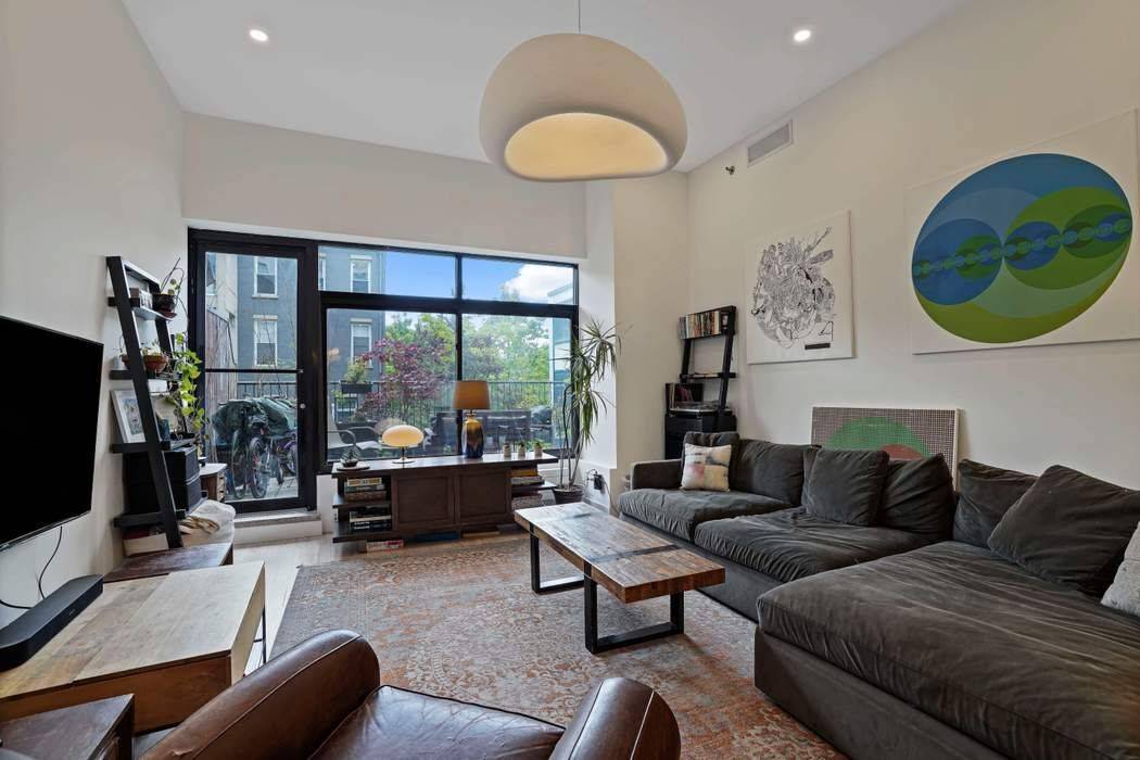 Residence 204 at the iconic Newswalk Condominium offers an exceptional blend of scale, volume, and modern comfort in the heart of Prospect Heights.