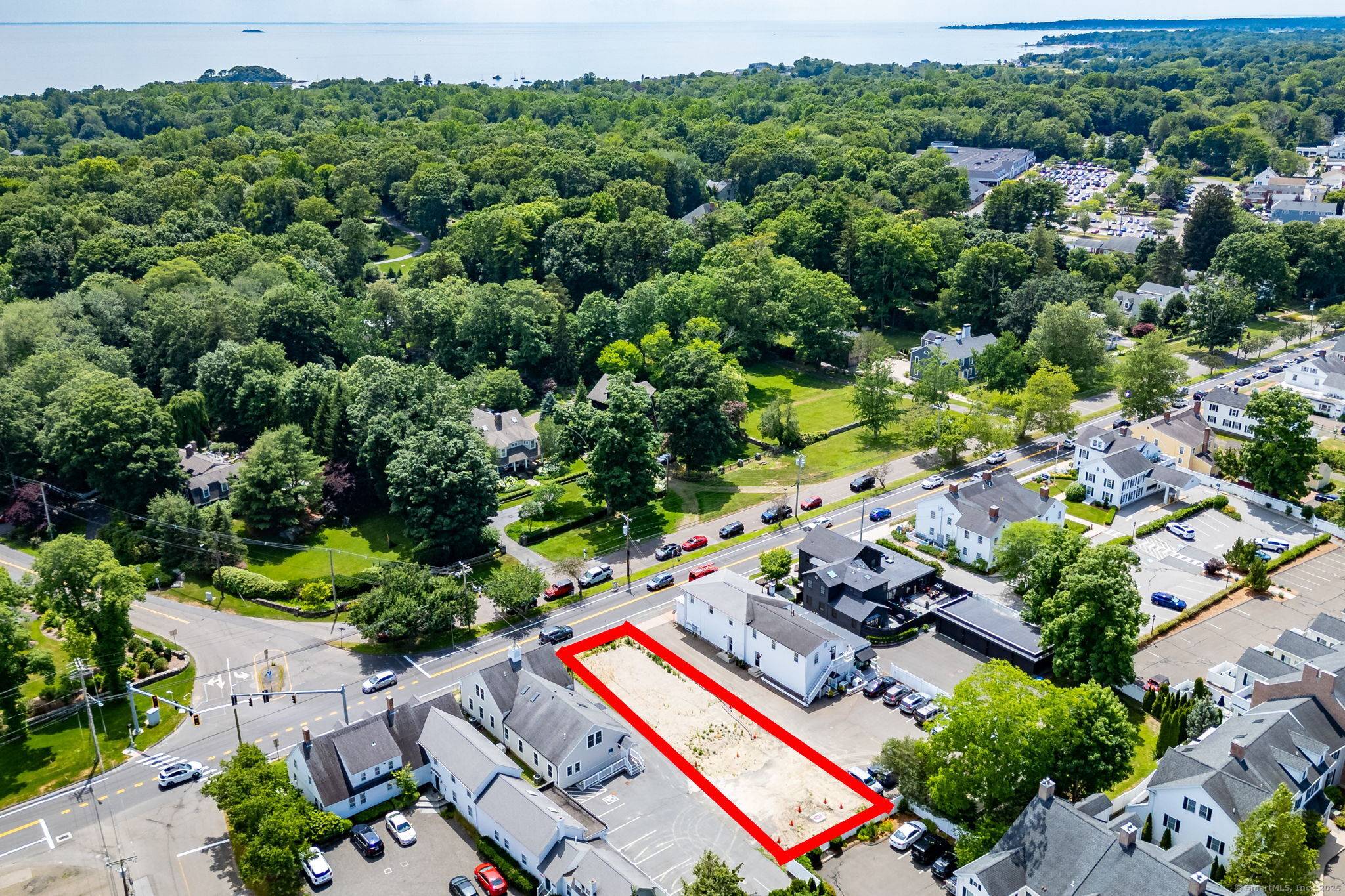 Fully approved and ready to go, this exceptional commercial lot is situated in the heart of vibrant downtown Madison.