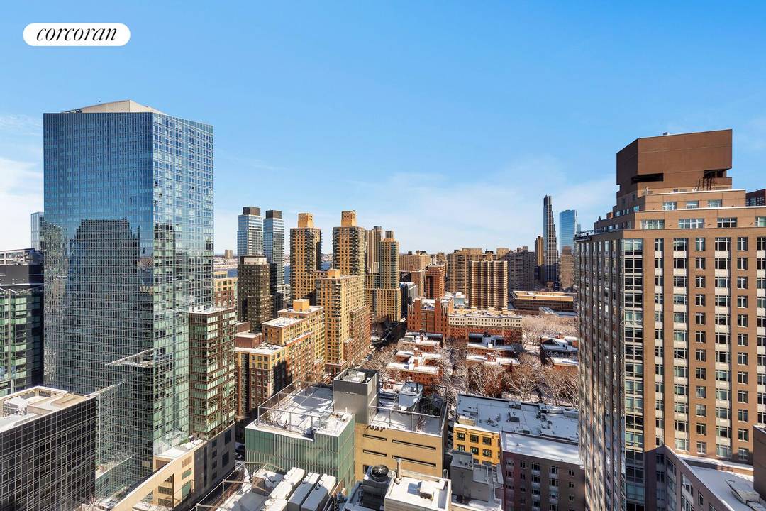 Spacious three bedroom atop the city with north and west exposures and open views.