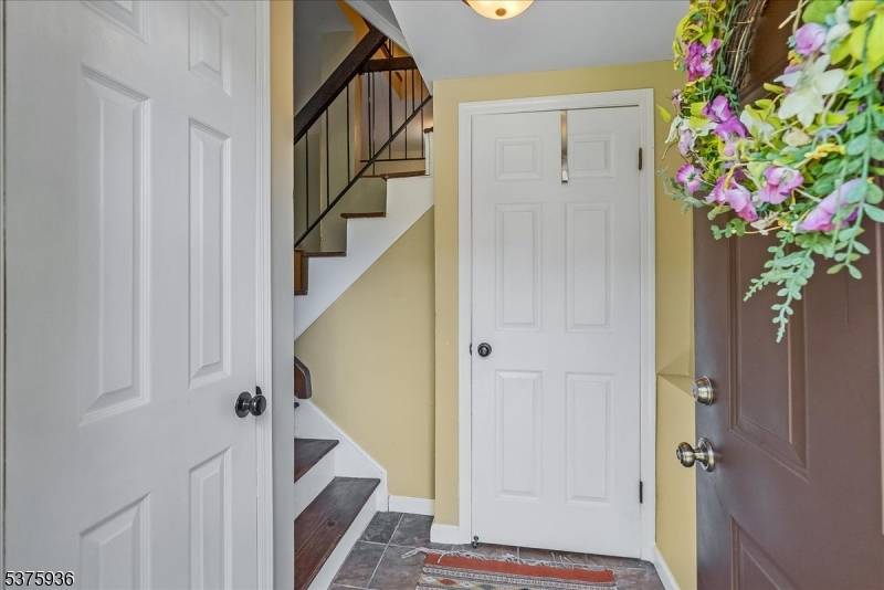 Spacious Hasting Square townhome with beautiful hardwood floors on both levels, generous size living room with fireplace, updated sliding door to balcony and adjacent dining area.