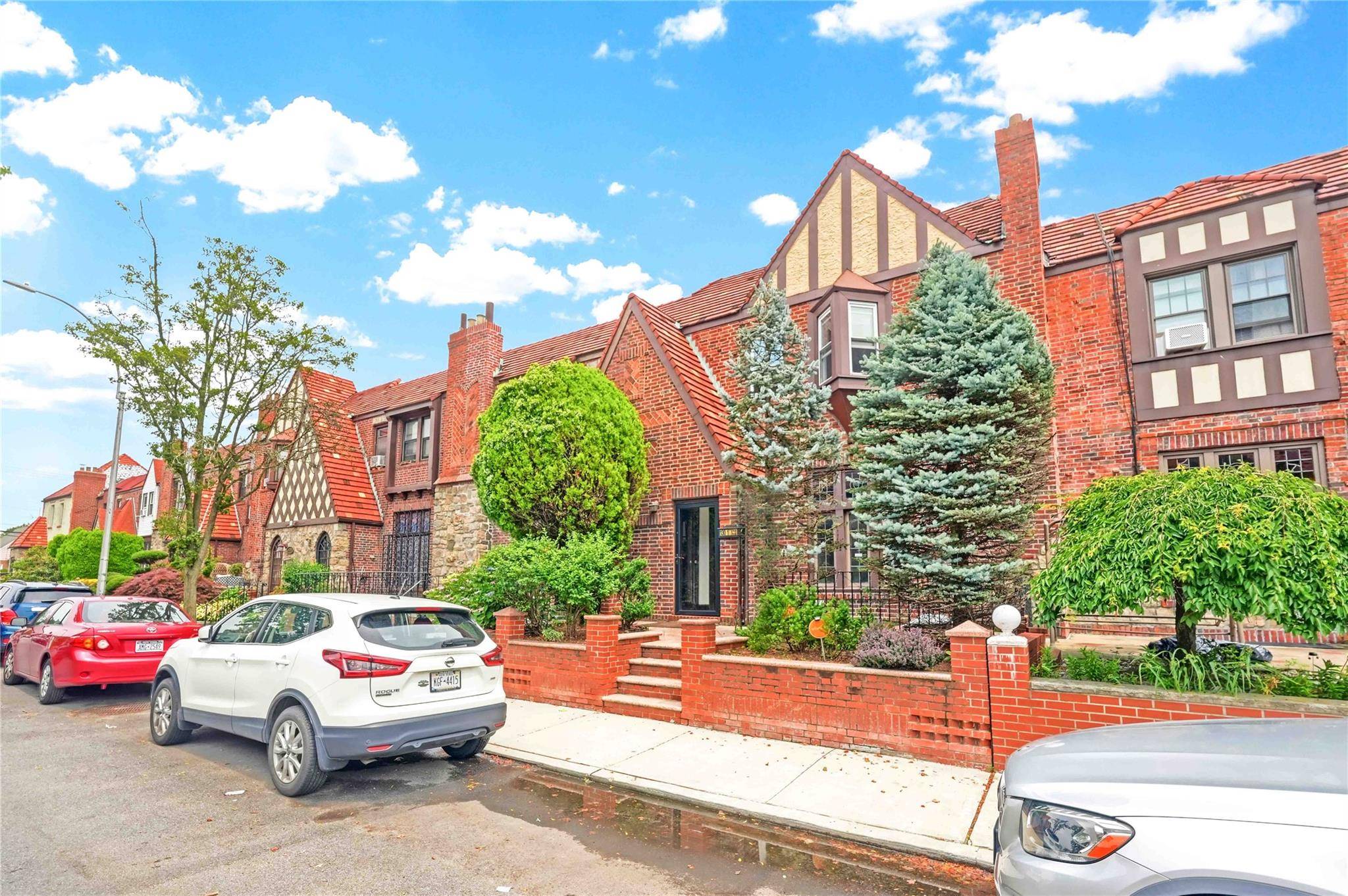 This beautiful Tudor style townhouse comes with first floor features a bright sunken living room with working fireplace and decor expose beam, formal dining room, kitchen and half bath.