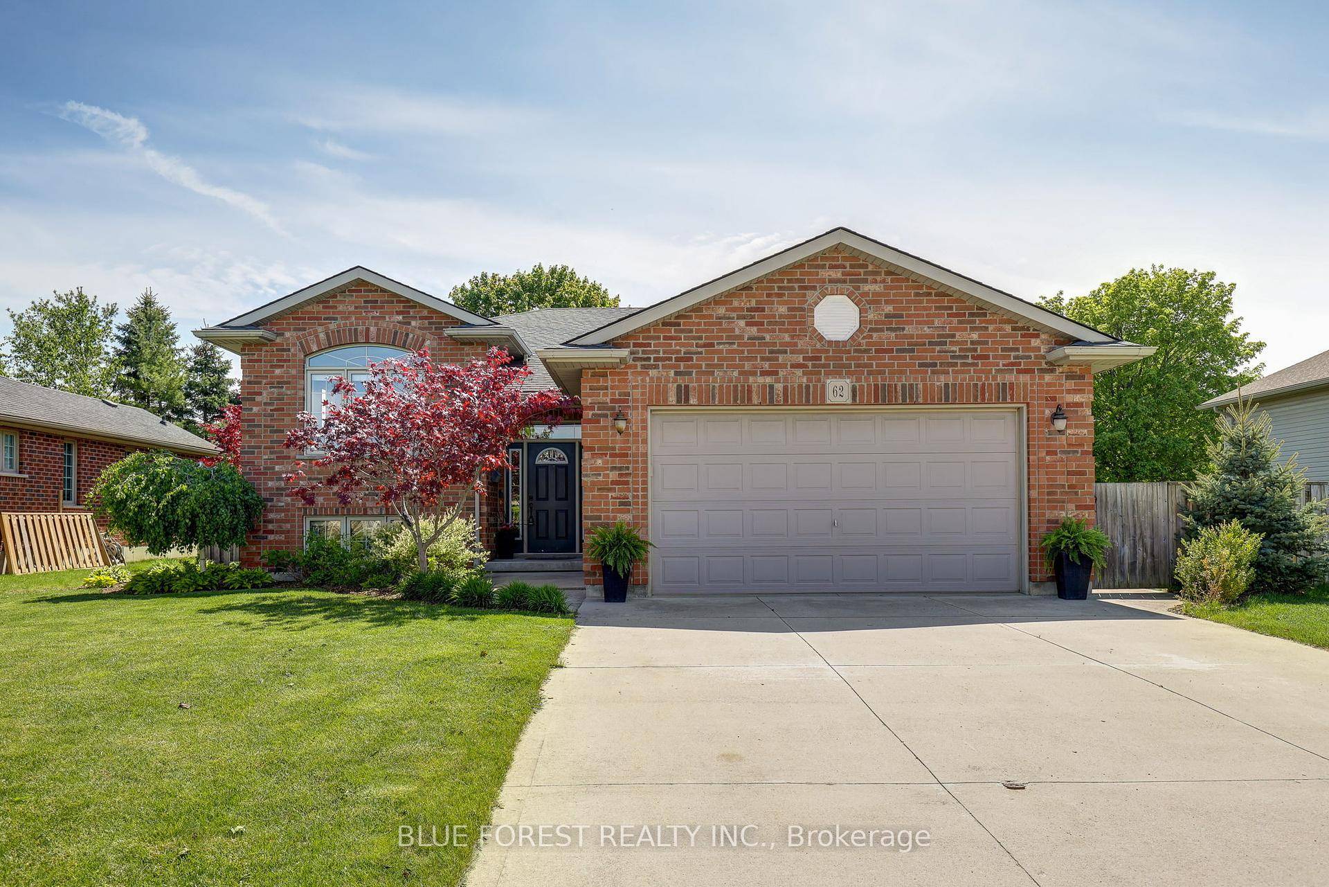 This beautifully landscaped and meticulously maintained raised bungalow is tucked away on a quiet street near the Mitchell Golf Course.