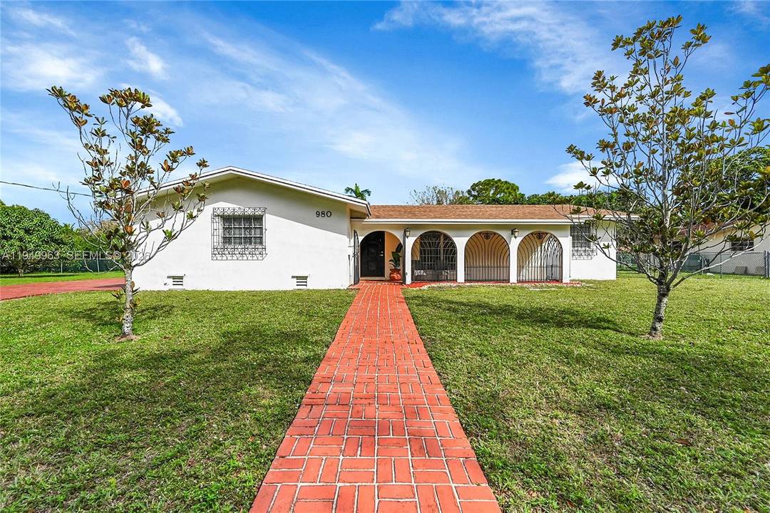 This charming waterfront home sits on an oversized lot one of the largest in the serene neighborhood of Royal Palm Estates offering ample space for family living and outdoor enjoyment.