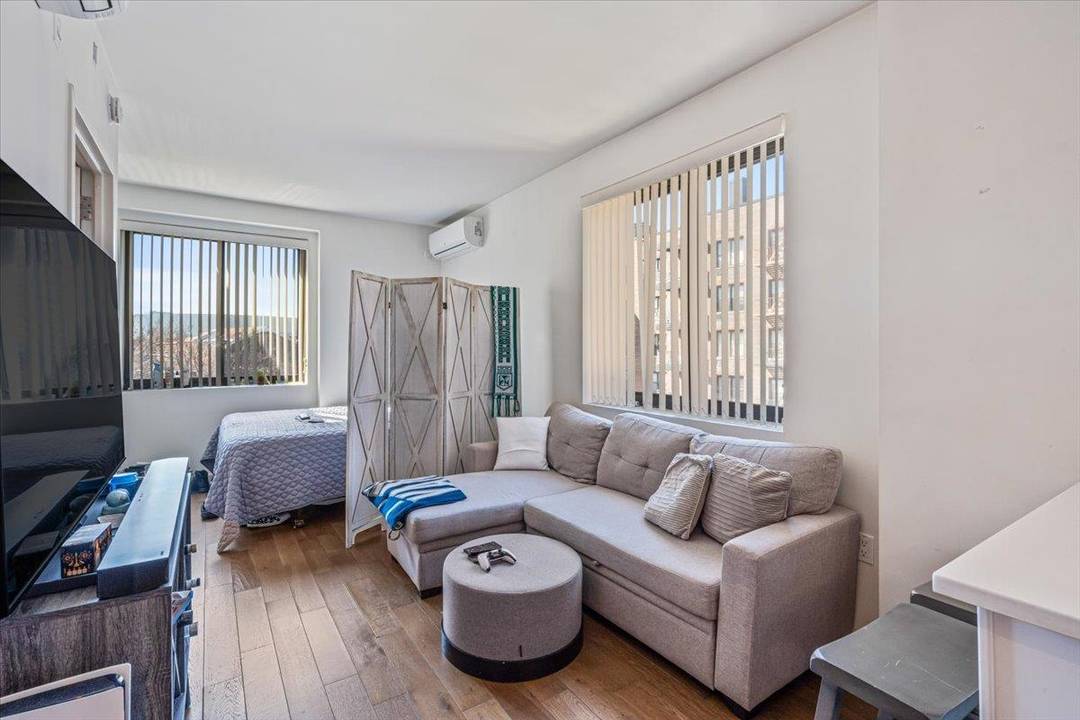 This rarely available luxury studio at Elm51 Condominium in Elmhurst offers modern elegance and premium comfort.