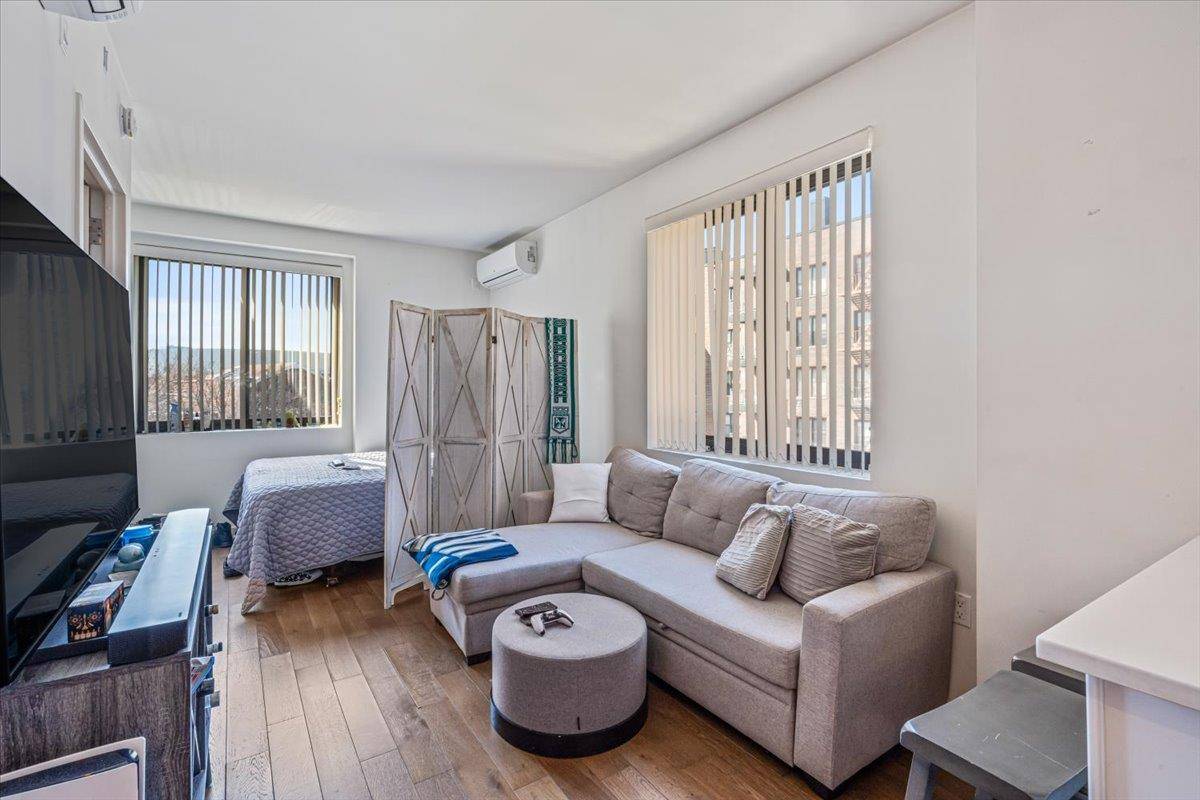 This rarely available luxury studio at Elm51 Condominium in Elmhurst offers modern elegance and premium comfort.