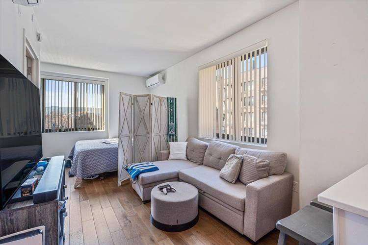 This rarely available luxury studio at Elm51 Condominium in Elmhurst offers modern elegance and premium comfort.