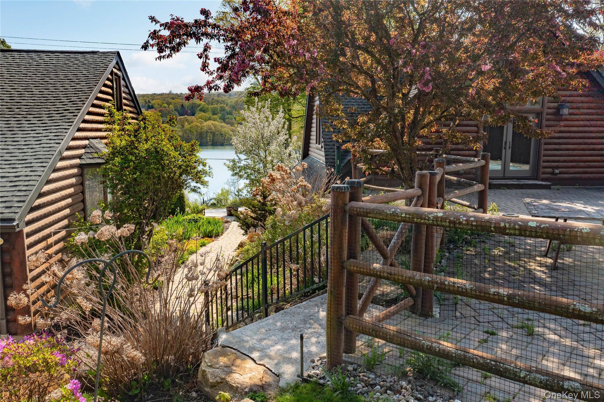 Welcome to 81 Lakeview Drive, a quintessential log cabin estate offering deeded lake rights and endless opportunities to embrace the coveted Whaley Lake lifestyle.