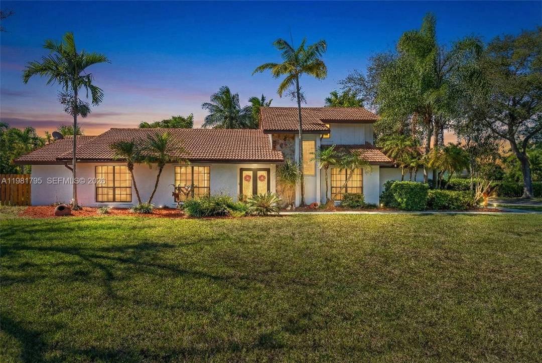 Sophisticated 4 2 estate on a rare half acre lot, expansive patio, pool and exceptional design Located in the desirable Stonewood neighborhood, this 2, 940 sq.