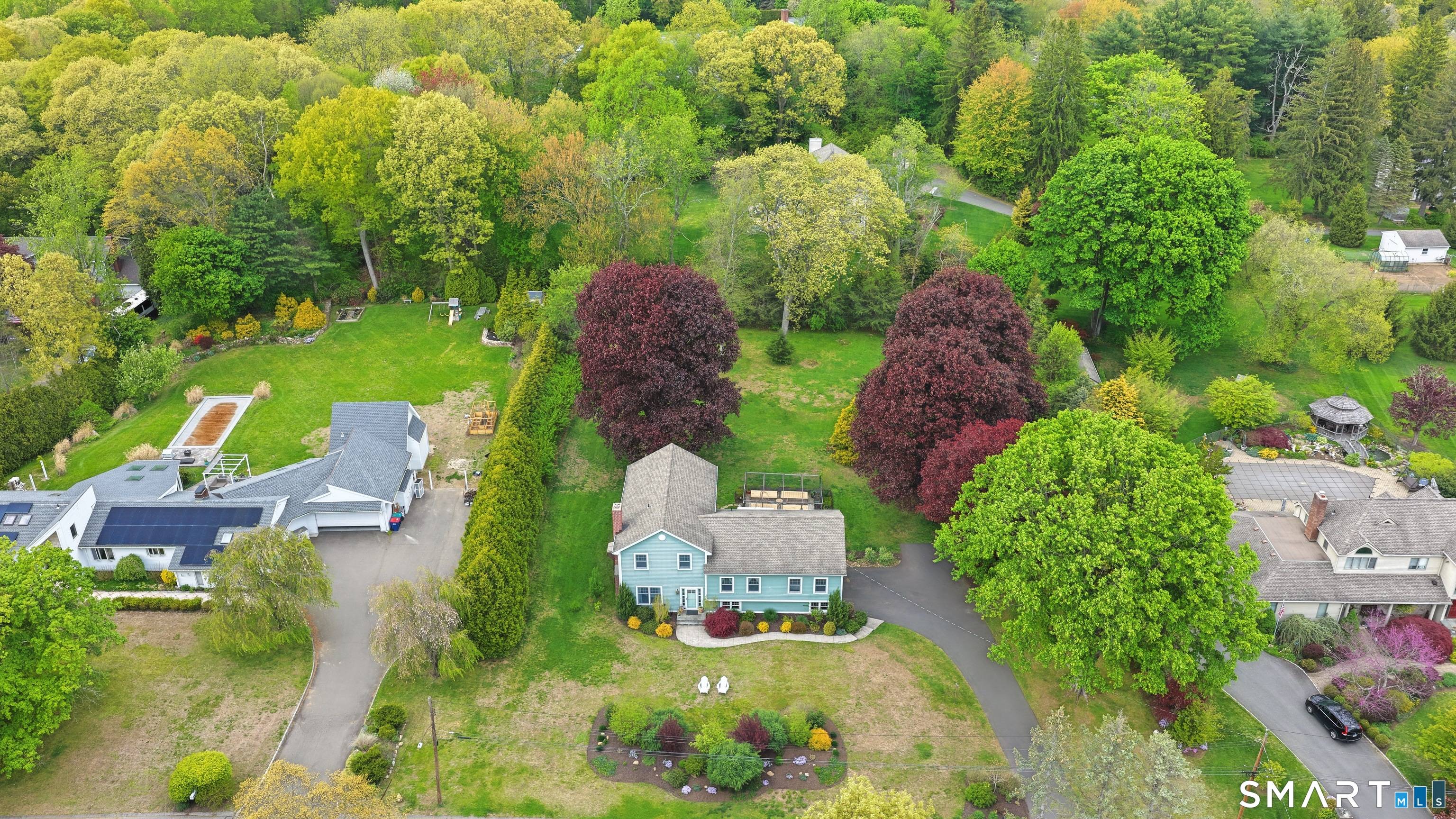 Welcome home to 22 Round Ridge Trail an inviting retreat nestled on a gorgeous, flat acre lot in the desirable Nichols neighborhood of Trumbull.