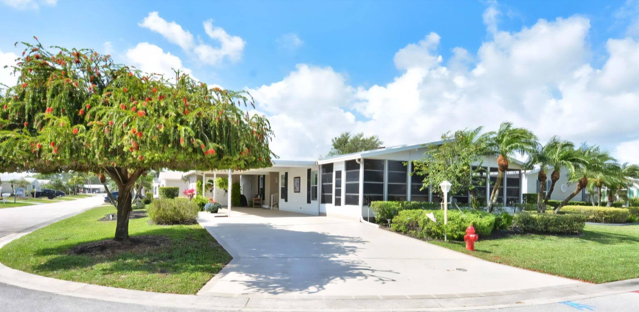 ABSOLUTELY STUNNING corner lot in the 55 plus community of Savanna Club !