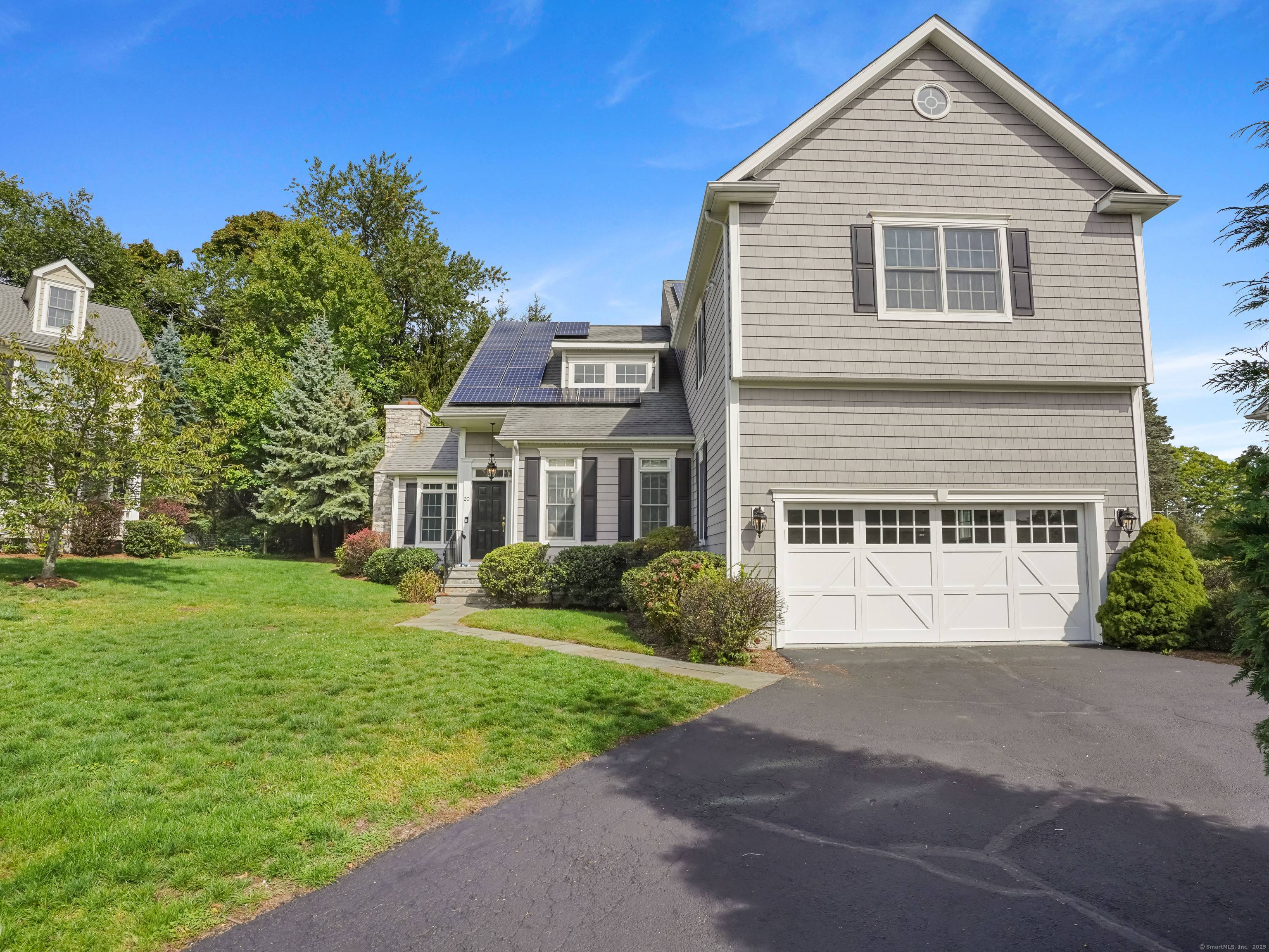 Welcome to 20 Walnut Ridge Lane where you can enjoy privacy within a quiet enclave of newer homes, yet just minutes to Stamford's vibrant downtown.