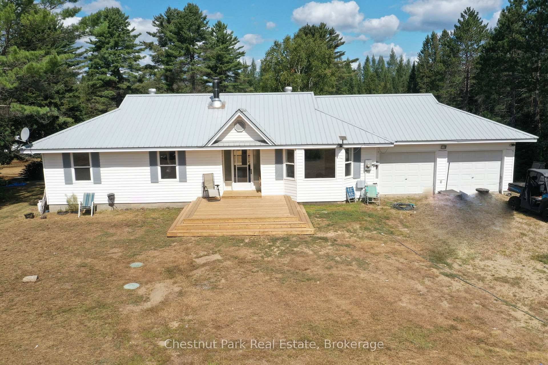 Welcome to 158 Selena, a bright and freshly updated raised bungalow with walkout basement nestled in 21 acres of privacy and stress free living, just 3 minutes from Buck Lake.