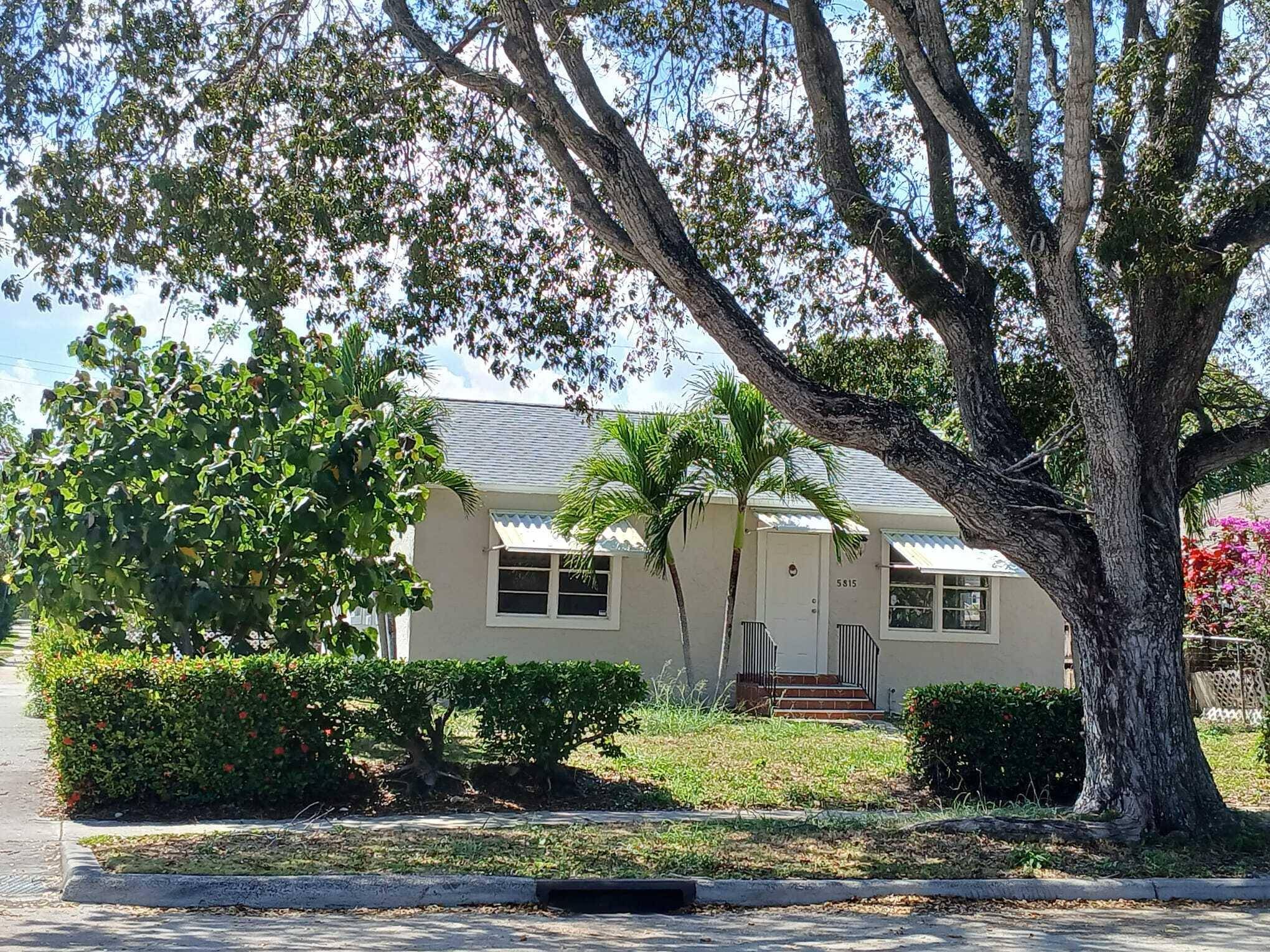 3 Bedroom 2 bath single family house on a large corner lot in a tree lined peaceful neighborhood.