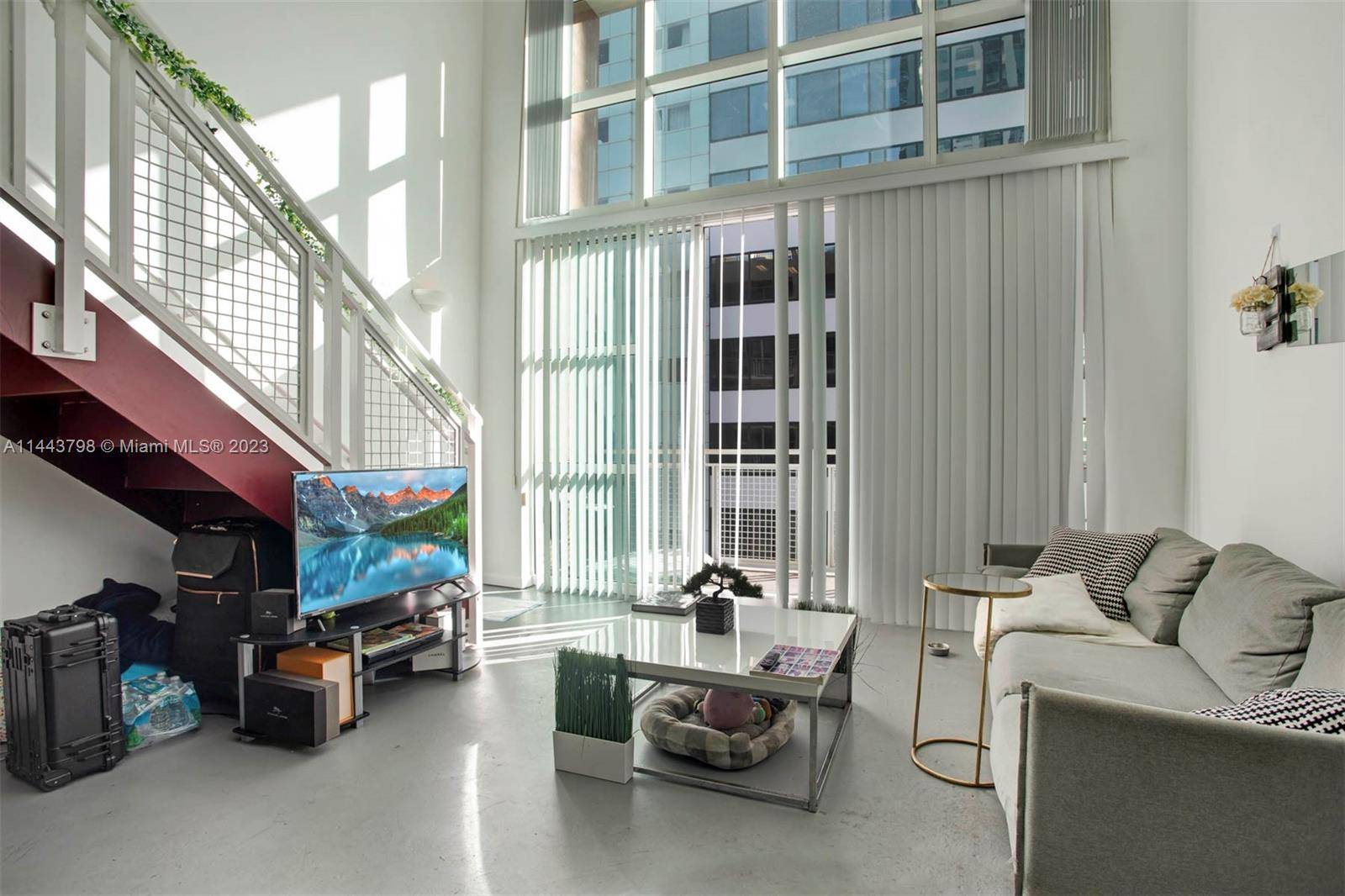 An incredible opportunity awaits a 2 story, 18 ft ceilings with a lot of natural light loft, balcony, and extra storage in Downtown Miami.