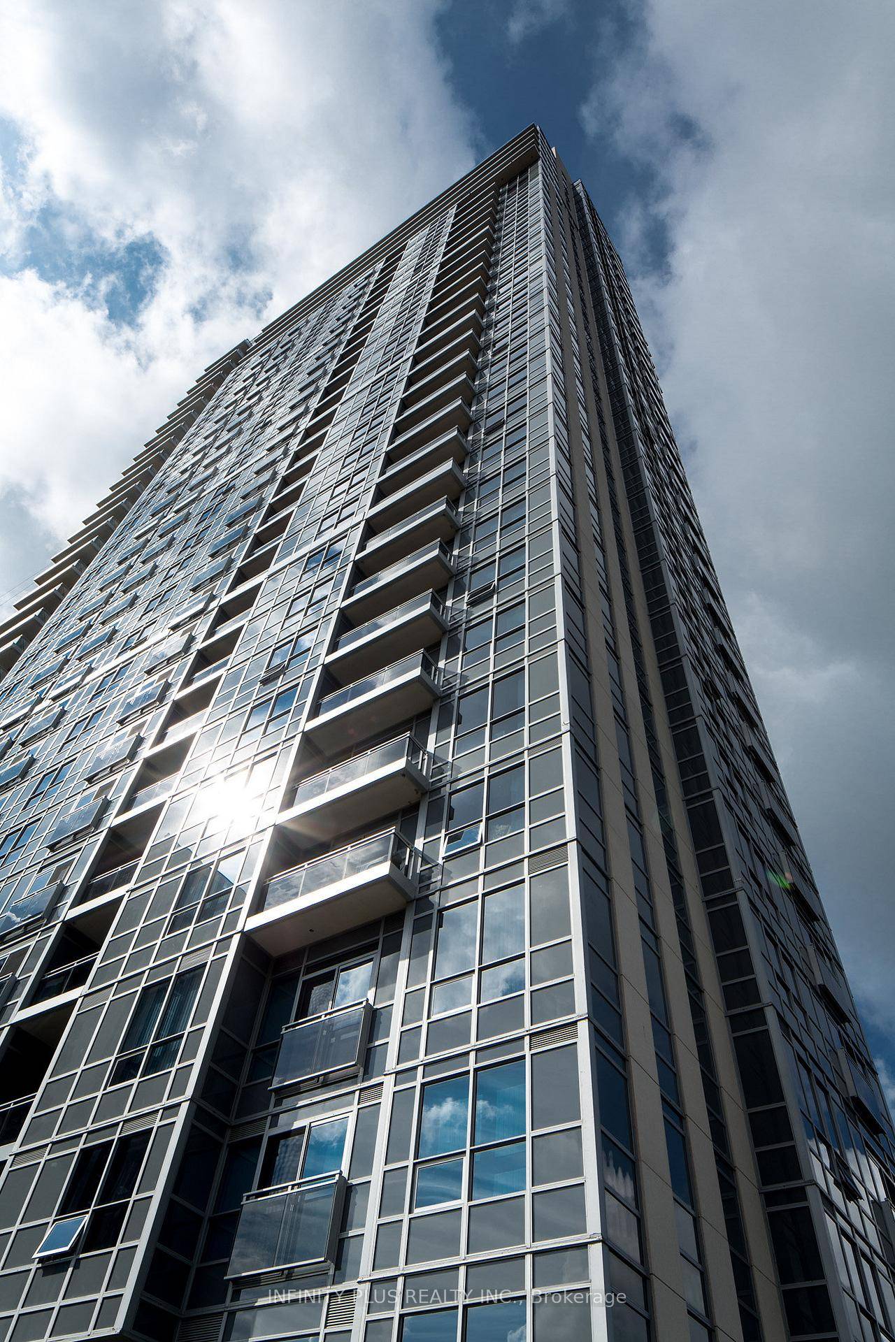 A Luxury Condominium offering a spacious 1 bedroom, 1 bathroom unit perched on a high floor with soaring 9 ceilings and large windows showcasing stunning city views.