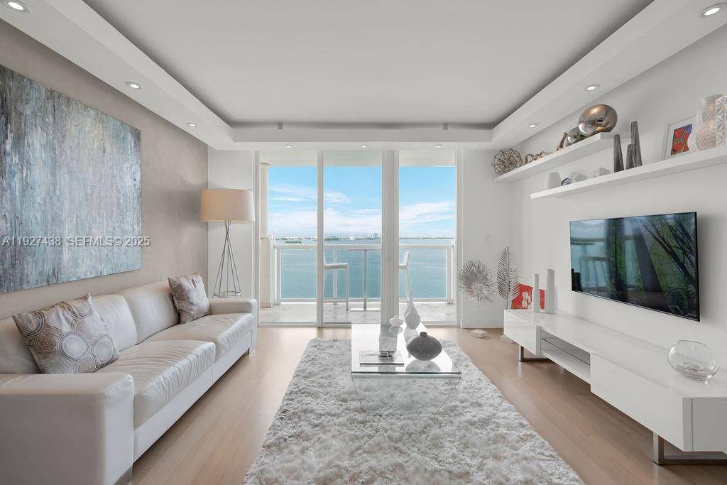 Discover this waterfront gem on Treasure Island in North Bay Village, a beautifully updated modern spacious condo offering stunning unobstructed water views from every room.